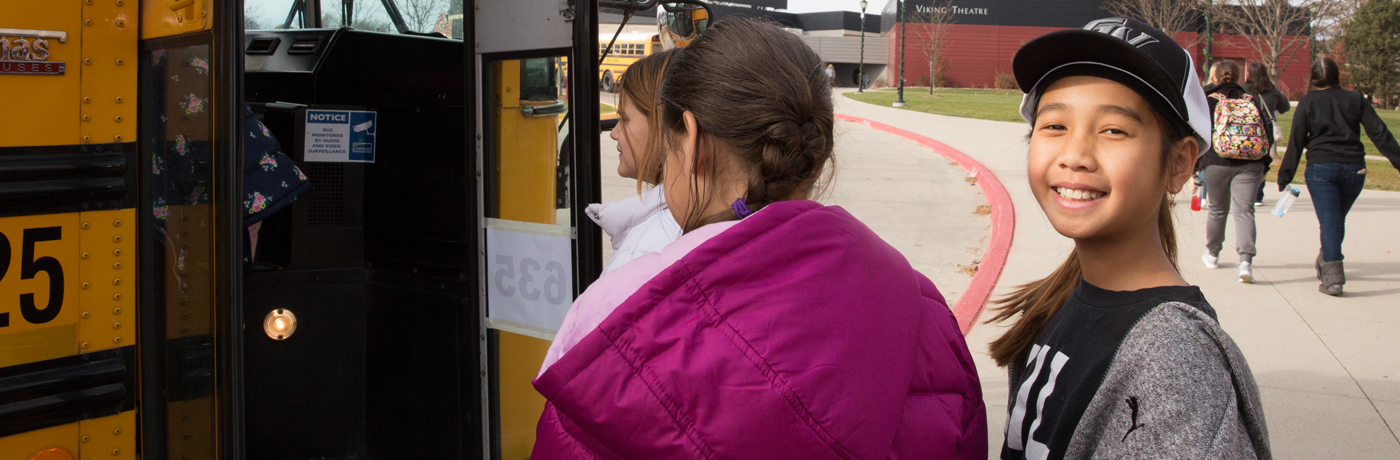 Findley Elementary School Students Boarding a Bus